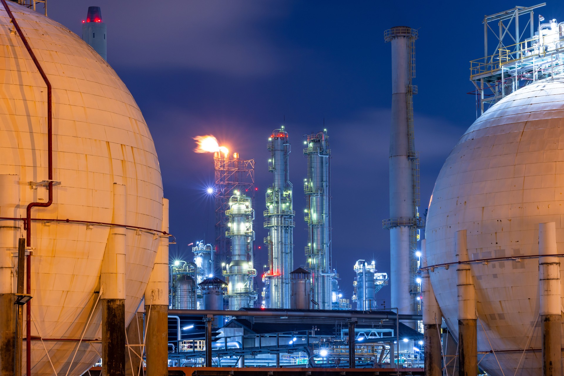 Gas separation plant at industrial estate under night sky, Industrial gas separation plant with sphere gas storage tank, Natural gas processing plant energy infrastructure.